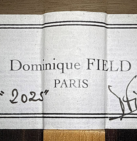 The label of a 2025 Dominique Field classical guitar made of spruce and CSA rosewood