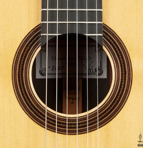 The rosette of a 2025 Dominique Field classical guitar made of spruce and CSA rosewood