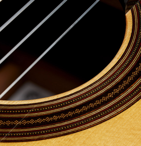 Detailed closeup of the rosette of a 2025 Dominique Field classical guitar made of spruce and CSA rosewood