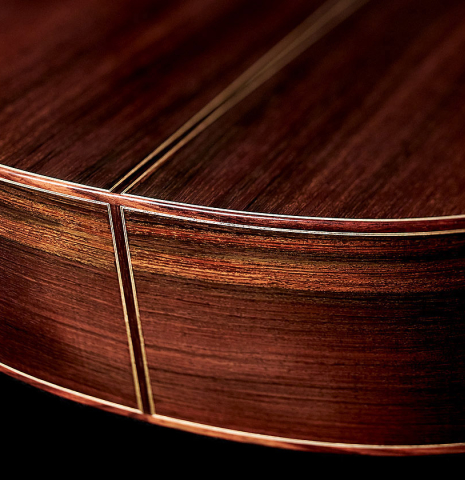The lower bout of a 2005 Dominique Field classical guitar made of spruce and CSA rosewood