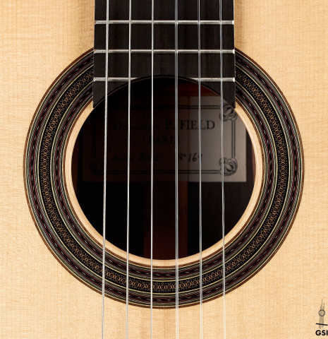 The rosette of a 2005 Dominique Field classical guitar made of spruce and CSA rosewood