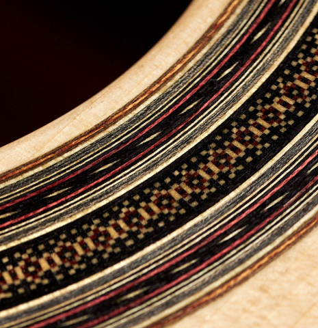 The rosette of a 2005 Dominique Field classical guitar made of spruce and CSA rosewood