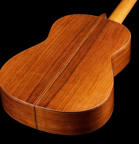 The back and sides of a 1992 Dominique Field classical guitar made of spruce and Indian rosewood