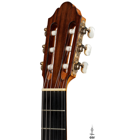 The headstock of a 1992 Dominique Field classical guitar made of spruce and Indian rosewood