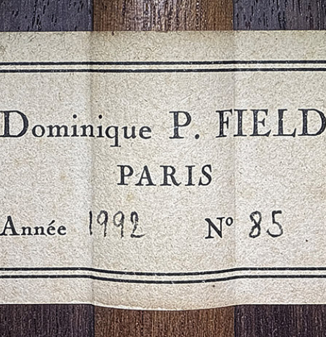 The label of a 1992 Dominique Field classical guitar made of spruce and Indian rosewood