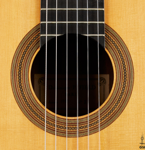 The rosette of a 1992 Dominique Field classical guitar made of spruce and Indian rosewood