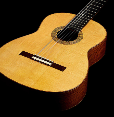 The soundboard of a 1992 Dominique Field classical guitar made of spruce and Indian rosewood