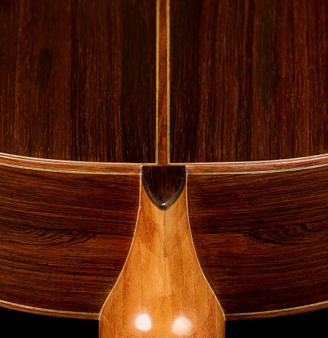 The heel joint, back binding and purfling of a 2011 Dominique Field classical guitar made of spruce and CSA rosewood