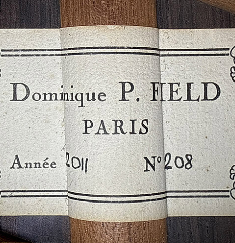The label of a 2011 Dominique Field classical guitar made of spruce and CSA rosewood