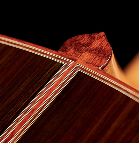 The heel of a 2007 Paul Fischer "Premier Taut" classical guitar made with spruce and CSA rosewood.