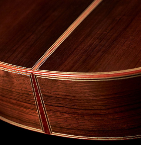 The lower bout of a 2007 Paul Fischer "Premier Taut" classical guitar made with spruce and CSA rosewood.