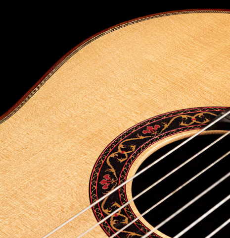 The soundboard of a 2007 Paul Fischer "Premier Taut" classical guitar made with spruce and CSA rosewood.
