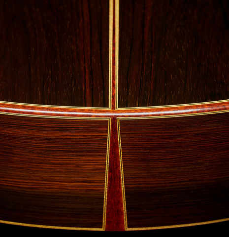 The back, sides, foot, back binding and purfling of a 1990 Paul Fischer "Virtuoso" classical guitar made of spruce and CSA rosewood