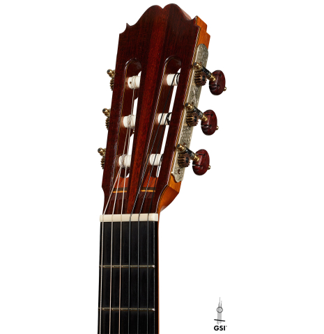 The headstock of a 1990 Paul Fischer "Virtuoso" classical guitar made of spruce and CSA rosewood
