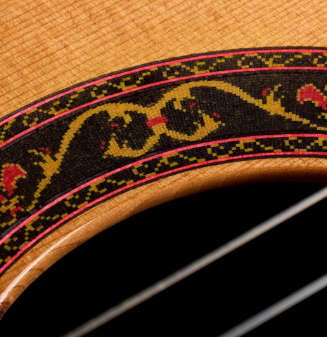 Closeup detail of the rosette of a 2008 Paul Fischer "Premier" classical guitar made of cedar and CSA rosewood