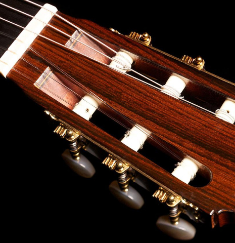 The headstock of a 1968 Ignacio Fleta classical guitar made of cedar and Indian rosewood