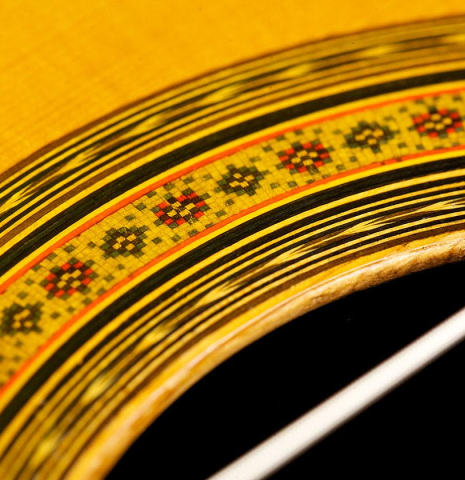 Closeup detail of the rosette of a 1965 Ignacio Fleta classical guitar made of spruce and CSA rosewood