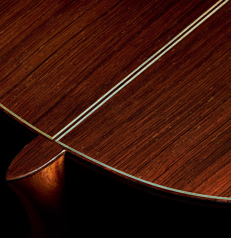 The heel and back purflings of a 1966 Ignacio Fleta classical guitar made of spruce and CSA rosewood