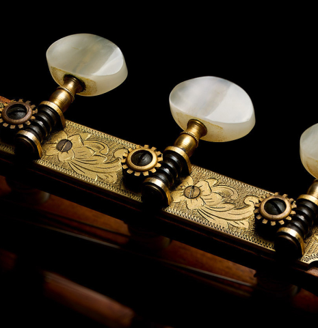 The tuning machines of a 1965 Ignacio Fleta classical guitar made of spruce and Indian rosewood