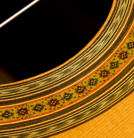 Detailed closeup of the rosette of a 1965 Ignacio Fleta classical guitar made of spruce and Indian rosewood