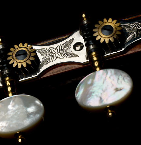 The tuning machines of a 1960 Ignacio Fleta classical guitar made of spruce and Indian rosewood