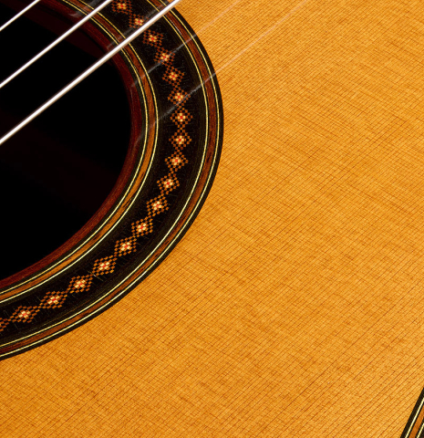 The soundboard of a 2008 Thomas Fredholm classical guitar (ex John Dearman) made of spruce, CSA and Indian rosewood