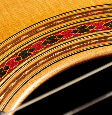 Detailed close-up of the rosette of a 2005 Daniel Friederich classical guitar (Romero collection) made of cedar and Indian rosewood