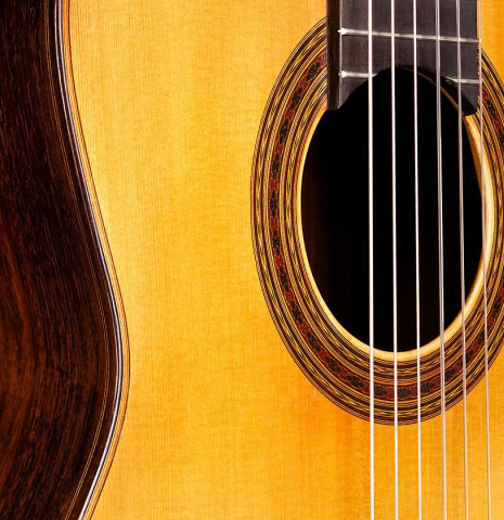 The soundboard and rosette of a 1969 Daniel Friederich classical guitar made of spruce and CSA rosewood