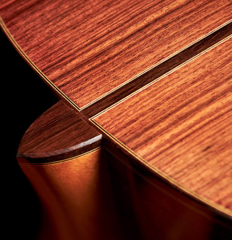 The heel of a 1994 Daniel Friederich classical guitar made of cedar and Indian rosewood.