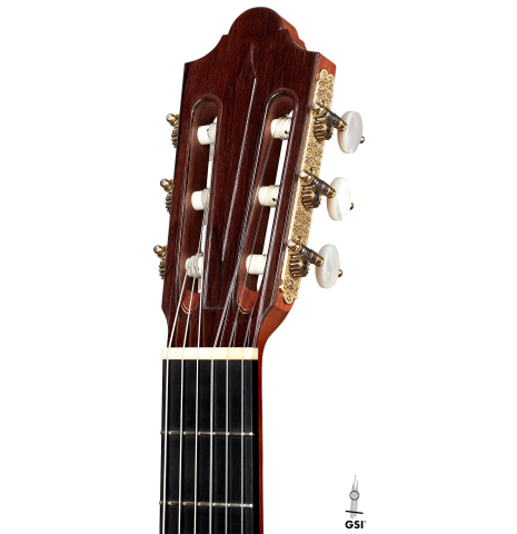 The headstock of a 1994 Daniel Friederich classical guitar made of cedar and Indian rosewood.