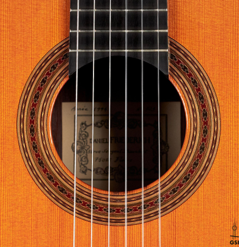 The rosette of a 1994 Daniel Friederich classical guitar made of cedar and Indian rosewood.