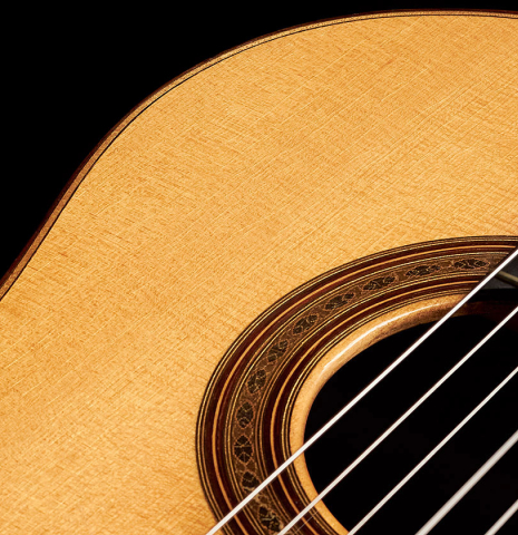 The soundboard and rosette of a 1964 Daniel Friederich "Recital" classical guitar made with spruce and CSA rosewood.
