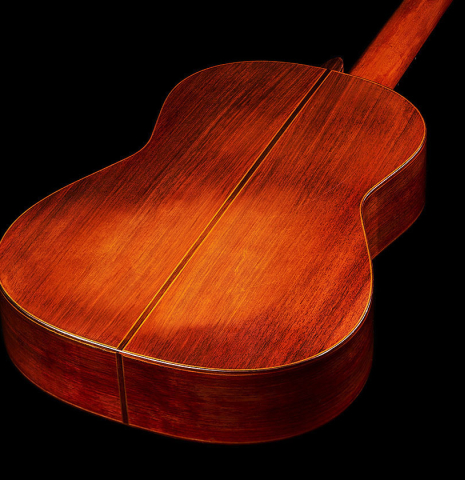 The back and sides at the foot of a 1984 Daniel Friederich classical guitar made of cedar and Indian rosewood.