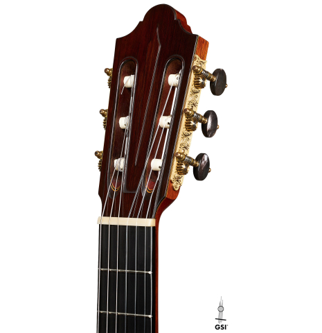 The headstock of a 1984 Daniel Friederich classical guitar made of cedar and Indian rosewood.
