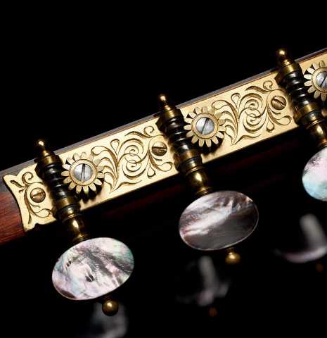 The Rodgers tuning machines of a 1984 Daniel Friederich classical guitar made of cedar and Indian rosewood.