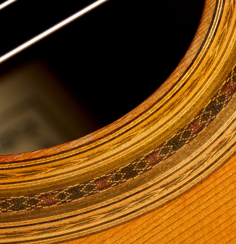 Closeup rosette detail of a 1988 Daniel Friederich (ex Roberto Aussel) classical guitar made of cedar and Indian rosewood.