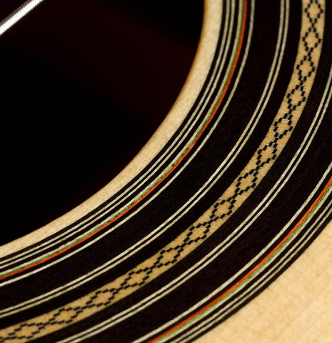 Detailed closeup of the rosette of a 2025 Liuteria Frignani "1910 Manuel Ramirez" classical guitar made of spruce and Indian rosewood