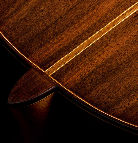 The heel, back binding and purfling of a 2025 Liuteria Frignani "1915 Enrique Garcia" classical guitar made of spruce and Indian rosewood