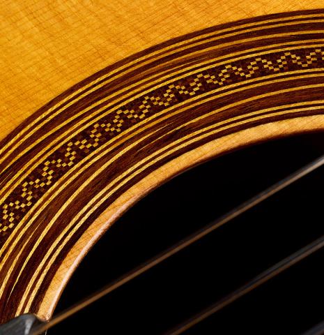 The soundboard and rosette detail of a 2025 Liuteria Frignani "1915 Enrique Garcia" classical guitar made of spruce and Indian rosewood