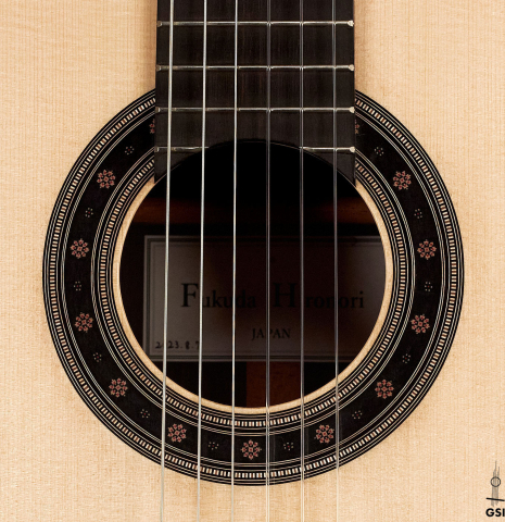 The rosette of a 2023 Hironori Fukuda classical guitar made with spruce and CSA rosewood
