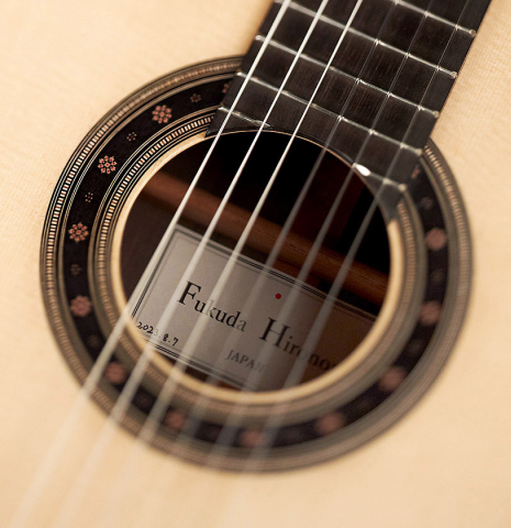 Closeup of the rosette of a 2023 Hironori Fukuda classical guitar made with spruce and CSA rosewood