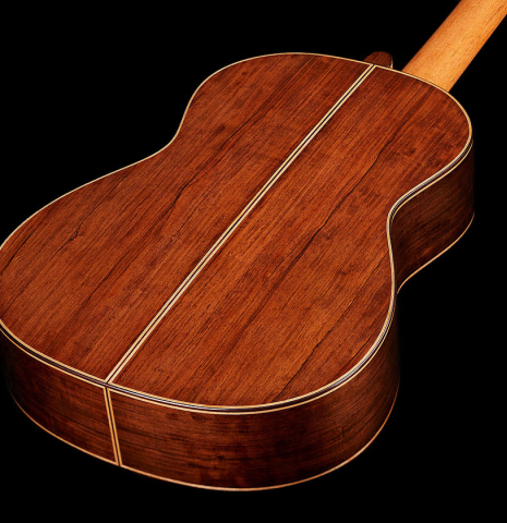 The back and sides of a 2024 Hironori Fukuda classical guitar made of spruce and African rosewood