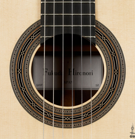 The rosette of a 2024 Hironori Fukuda classical guitar made of spruce and African rosewood