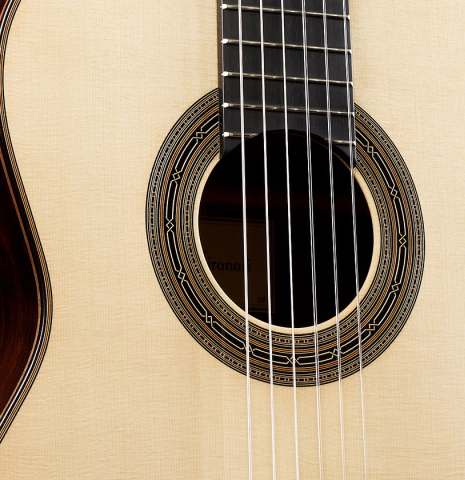 The top and rosette of a 2024 Hironori Fukuda classical guitar made of spruce and African rosewood