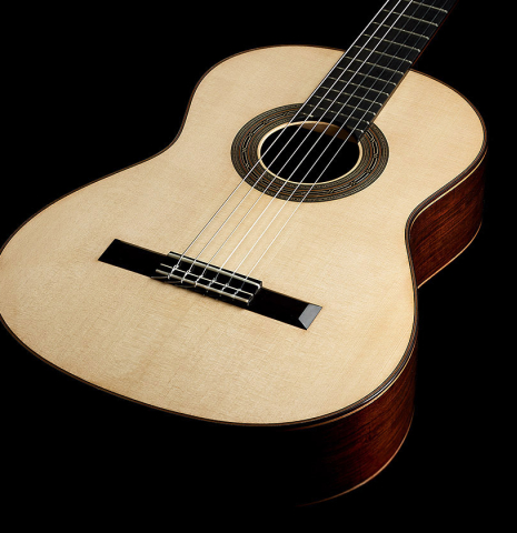 The soundboard of a 2024 Hironori Fukuda classical guitar made of spruce and African rosewood