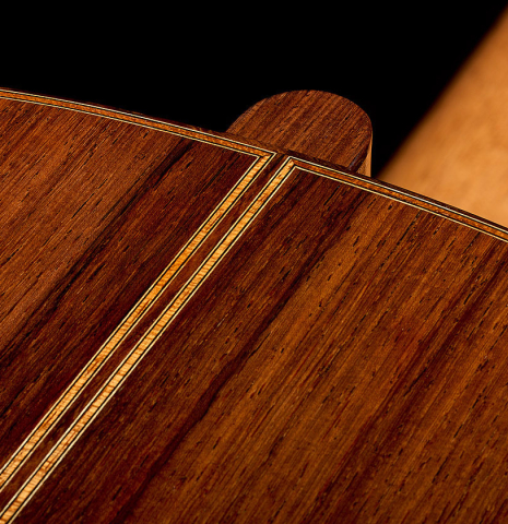 The heel, back binding and purfling of a 2026 Hironori Fukuda classical guitar made of spruce and African rosewood