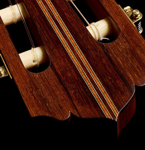 The head veneer and tuning machines of a 2026 Hironori Fukuda classical guitar made of spruce and African rosewood