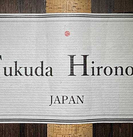 The label of a 2026 Hironori Fukuda classical guitar made of spruce and African rosewood