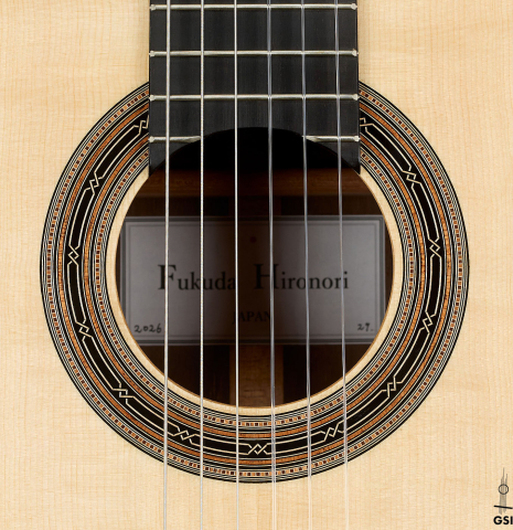 The rosette of a 2026 Hironori Fukuda classical guitar made of spruce and African rosewood