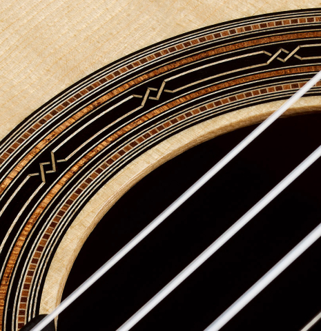 Detailed closeup of the rosette of a 2026 Hironori Fukuda classical guitar made of spruce and African rosewood